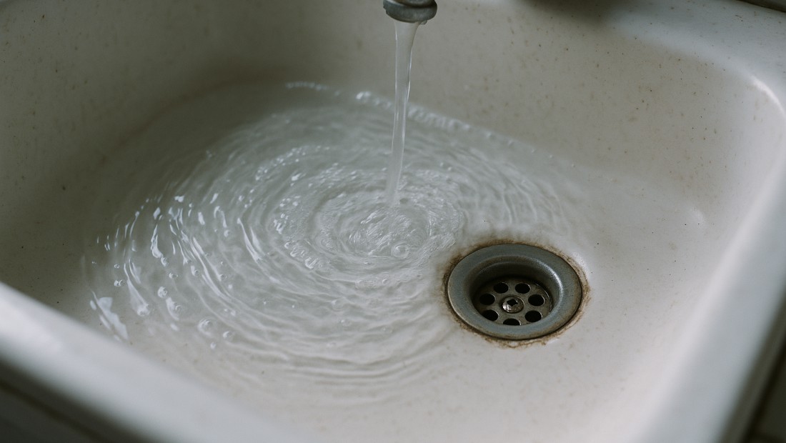 Water draining slowly from a sink in an Albany home